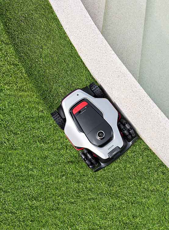 DREAME A3 AWD Pro 2500 kosi trawę wokół muru